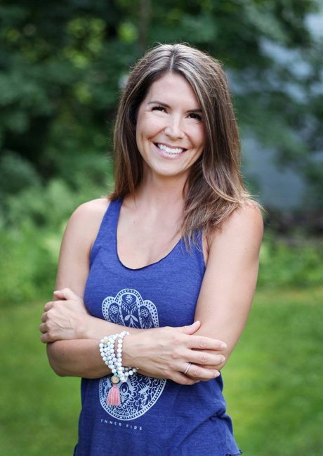Natasha Moine in yoga clothing smiling