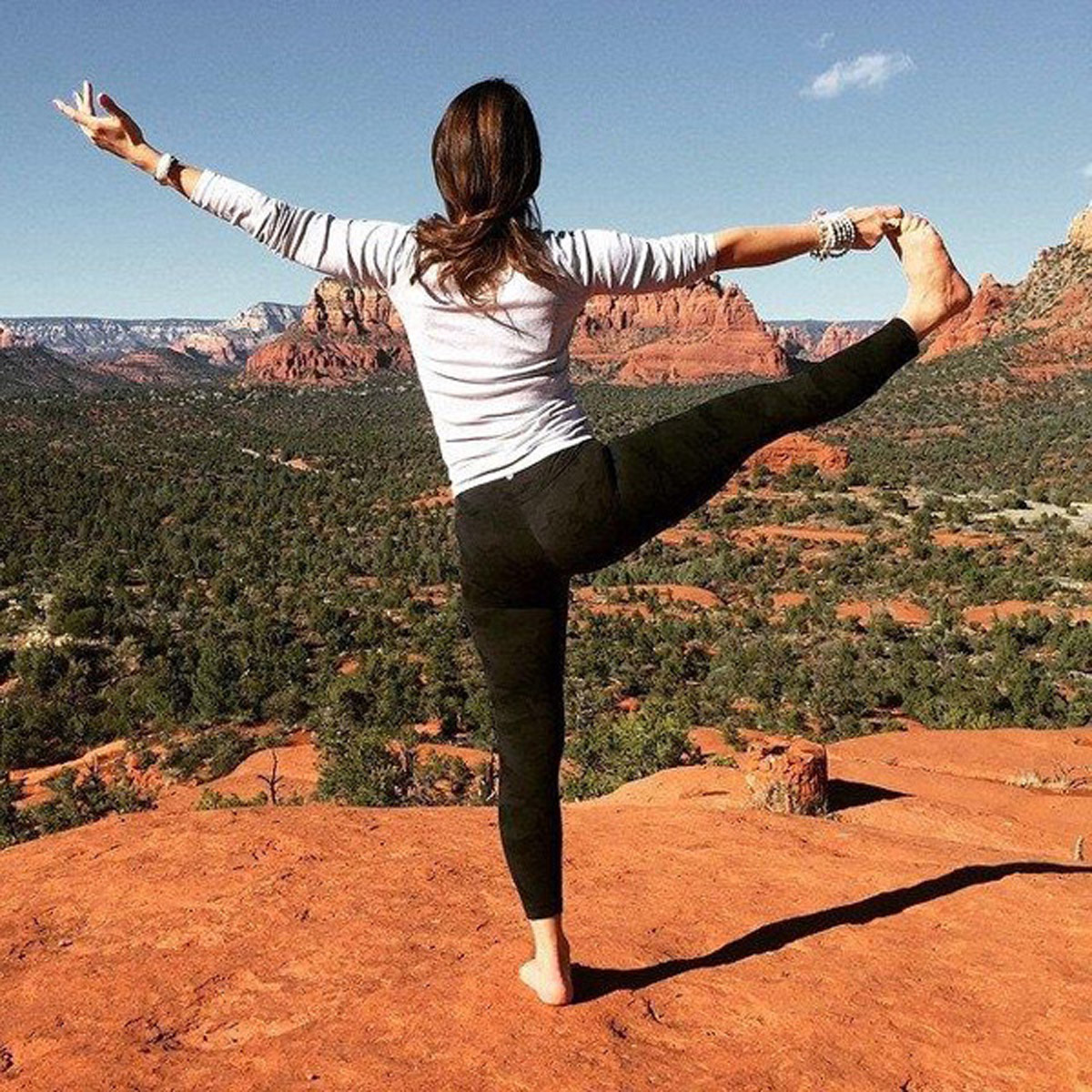 Natasha Moine in standing yoga pose in the Grand Canyon